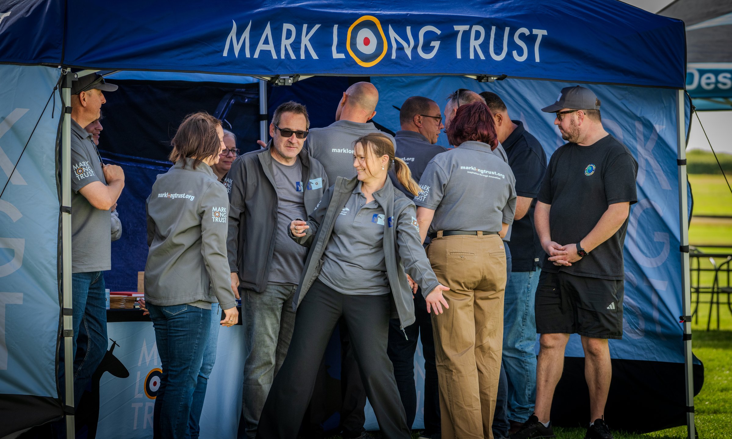 Volunteers gathered under the Mark Long Trust gazebo at Wickenby. Credit: Crash Gate Aviation.