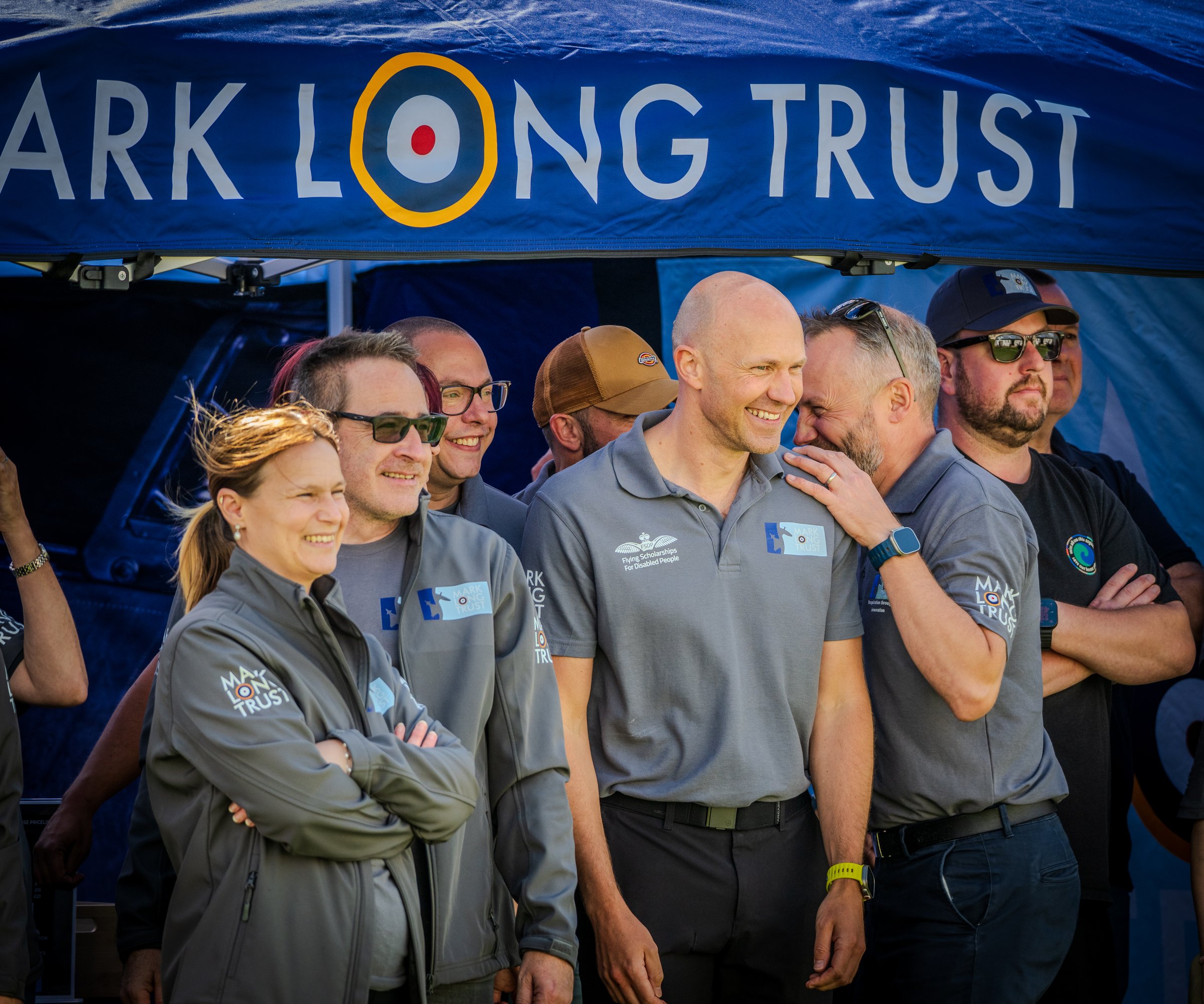 Trustees and volunteers under the Mark Long Trust gazebo at Wickenby. Credit: Crash Gate Aviation.