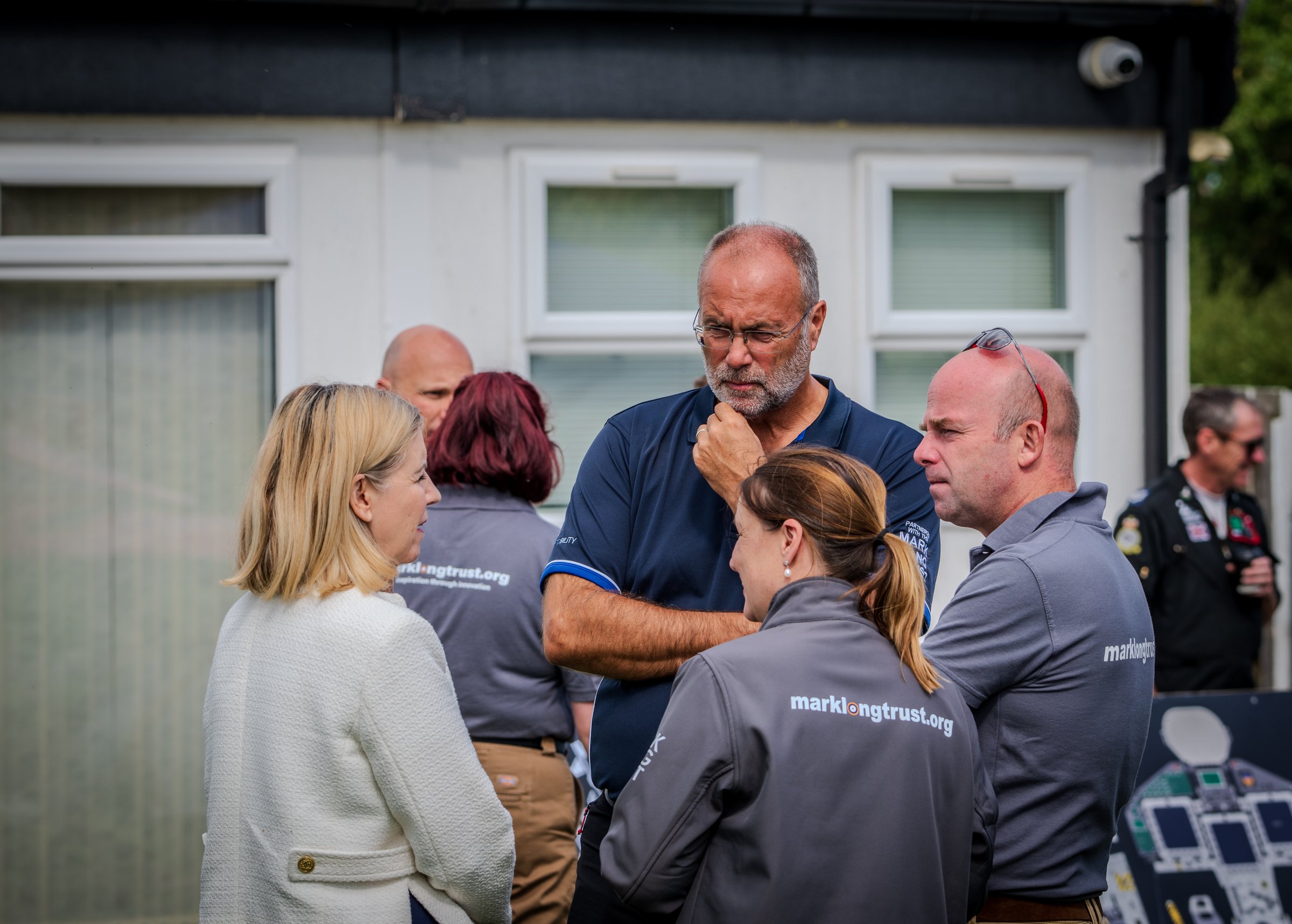 Conversation outside the flying school at the Wickenby launch. Credit: Crash Gate Aviation.